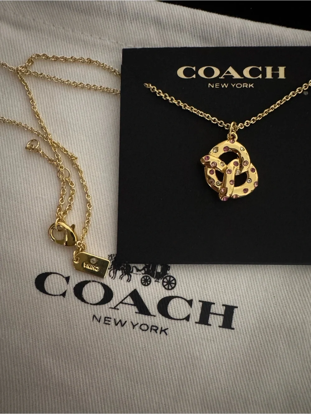 Coach Gold Pretzel Pendant Necklace with Pink Accents